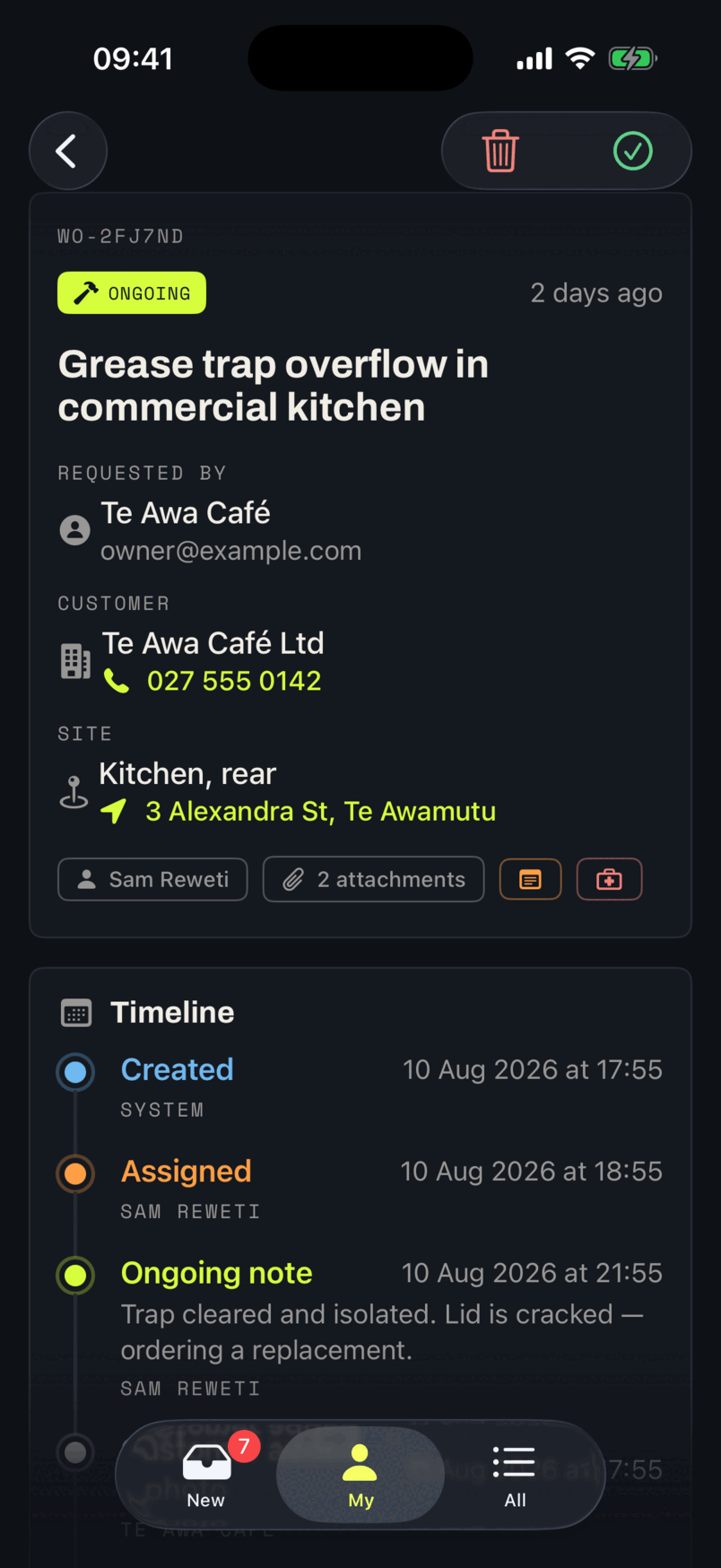 A work order in the app: reference WO-2FJ7ND, an ongoing badge, who requested it, the customer with a tappable phone number, the site and its address, and two attachments.