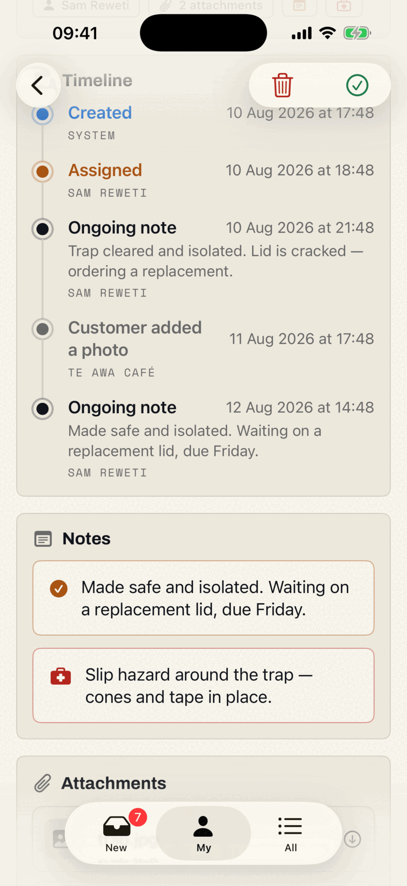 The timeline card in the app: created, assigned, an ongoing note from the technician, a photo the customer added from the portal, and a second note — each with a date, a time and a name.